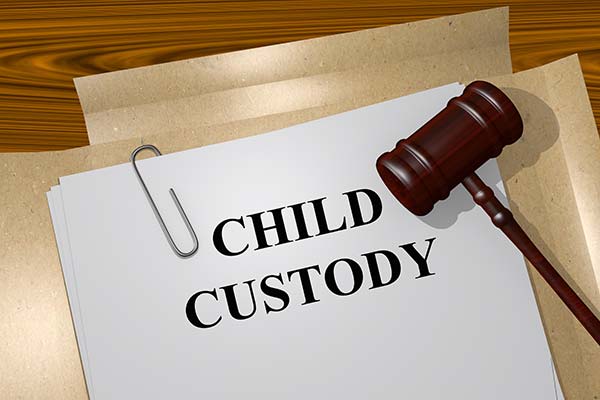 Child custody folder and judge gavel.